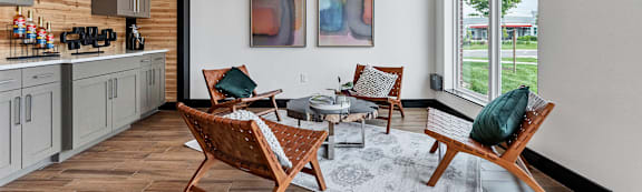 A living room with a grey couch and a wooden table.