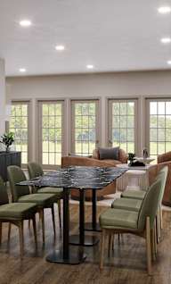 A dining room with a table set for six.