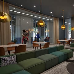A modern lounge area with people sitting and standing.