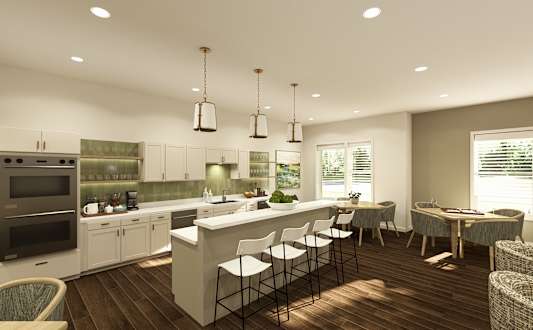 A modern kitchen with a bar area and dining table.