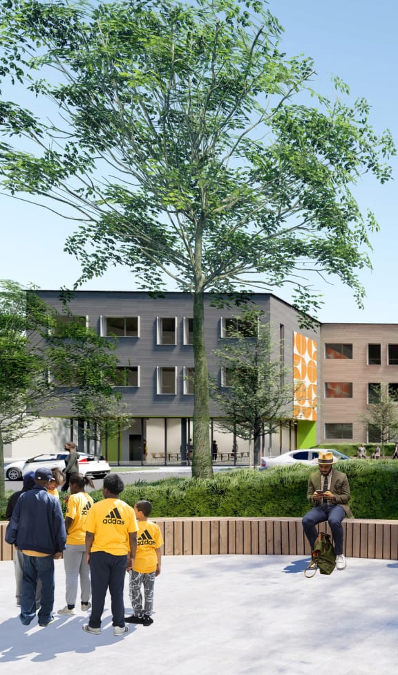a building on the corner of a street with cars parked in front of it