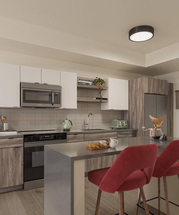 Modern kitchen with a large island and red chairs at Kinline, Beaverton, OR