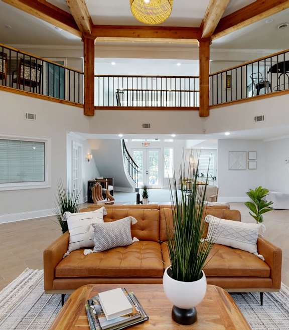 A living room with a brown sofa and a coffee table. at Vinings RiverVue, Atlanta, 30339
