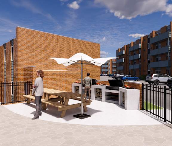A woman is standing in front of a brick building with a white umbrella. at The Park on 13 Apartments - Royal Oak, MI Apartments, Royal Oak, MI, 48073