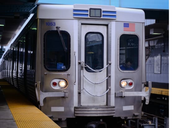 a subway train stopped at a train station at The Weaver, Philadelphia, Pennsylvania