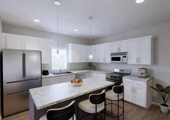 A modern kitchen with a granite countertop and stainless steel appliances.
