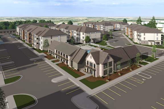A rendering of a residential complex with a parking lot in front. at The Logan Luxury Apartments, Nampa, ID