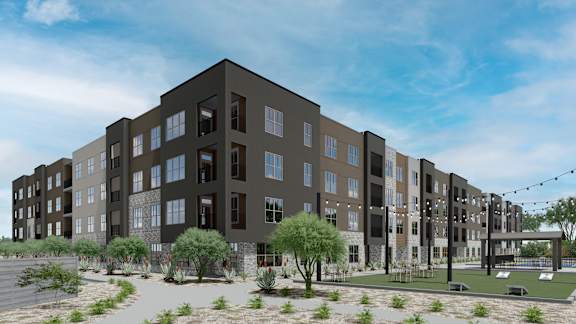 A modern apartment complex with a pool and landscaping. at Refinery at Pointe17 Apartments, Phoenix, AZ, 85085