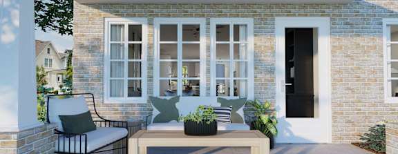 A patio with a bench and a chair.