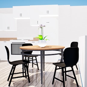 A table with chairs and a vase of flowers on a balcony.