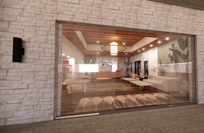 A modern interior with a stone wall and a glass door.