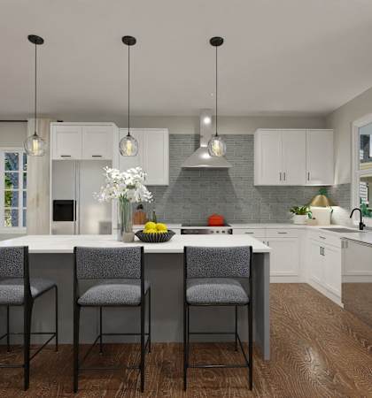 A modern kitchen with white cabinets and a wooden island.