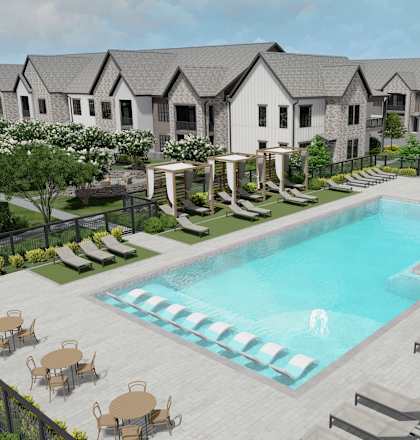 A pool surrounded by lounge chairs and umbrellas is the centerpiece of a resort-style outdoor area at The Levi Luxury Apartments, McDonough, GA 30253
