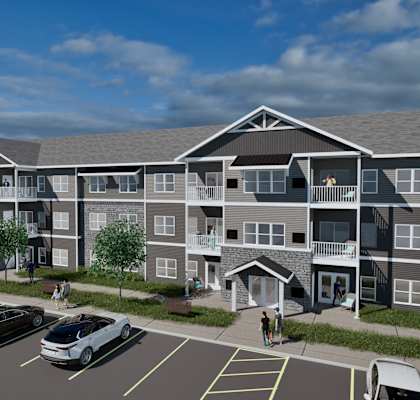 A rendering of a modern apartment complex with a parking lot in front.
