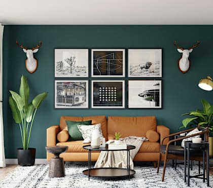 A living room with a green wall and a couch.