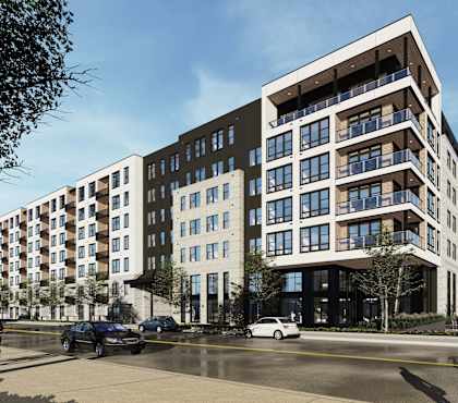 a rendering of an apartment building on a city street
