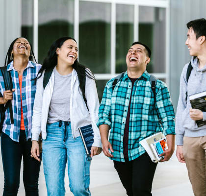 Group of students walking and laughing
