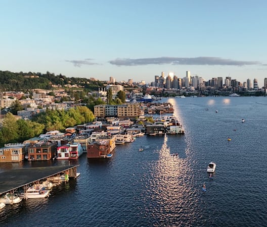 an aerial view of a river with boats and a city in the background at Liza Apartments, Washington