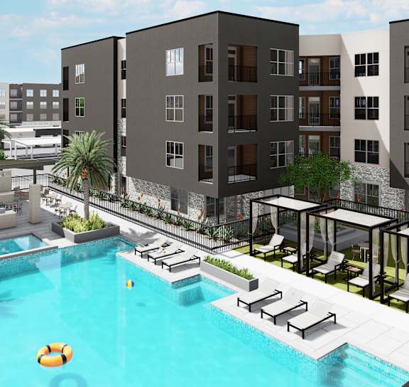 A pool surrounded by lounge chairs and umbrellas is the centerpiece of a resort-style courtyard at Refinery at Pointe17 Apartments, Phoenix, AZ