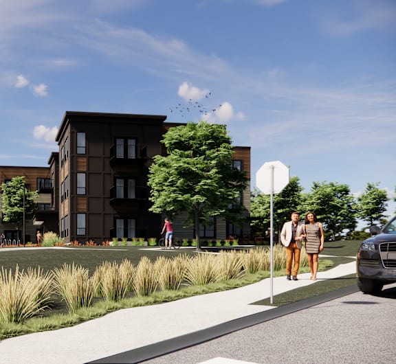 A street view of a residential area with apartment buildings, cars, and people.