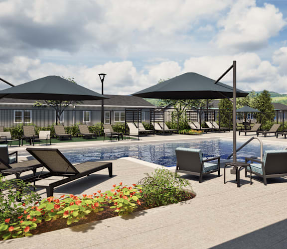 A poolside area with sun loungers and umbrellas.