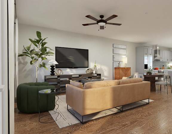 A living room with a beige couch and a television.