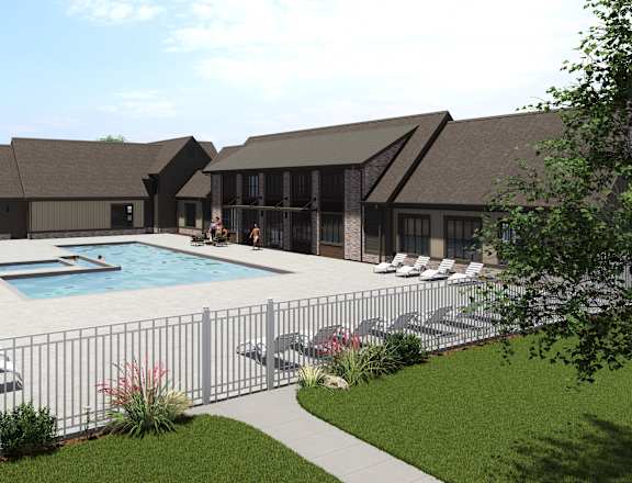 A pool surrounded by a fence and chairs. at The Logan Luxury Apartments, Idaho, 83651