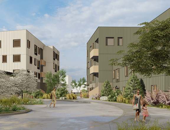 A modern building complex with a courtyard and people walking.