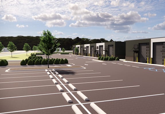 A parking lot with a building in the background.