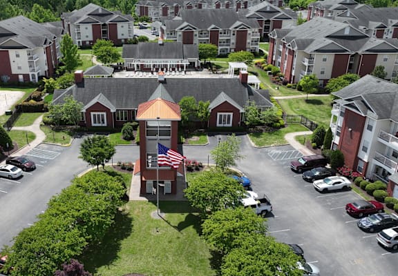 A bird's eye view of a residential area with houses and cars.