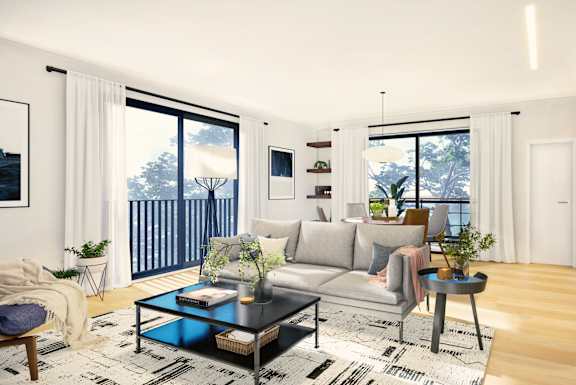 a living room with a gray couch and a black coffee table