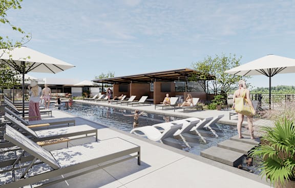 A poolside scene with people relaxing and a building in the background.