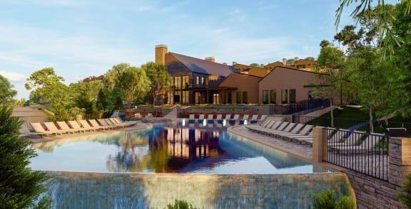 a swimming pool with chairs in front of a house at Terraces at High Mountain, Huntsville Alabama