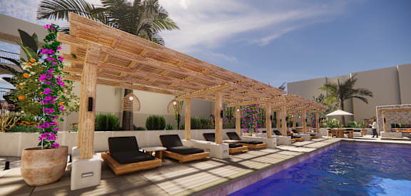 A pool area with a wooden pergola and lounge chairs.