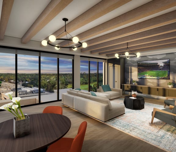 a rendering of a living room with a large screen tv on the wall and large windows at 2929 on Mayfair, Wauwatosa
