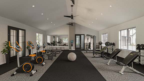 A gym with a variety of equipment including treadmills, weights, and a medicine ball at The Levi Luxury Apartments, Georgia 30253