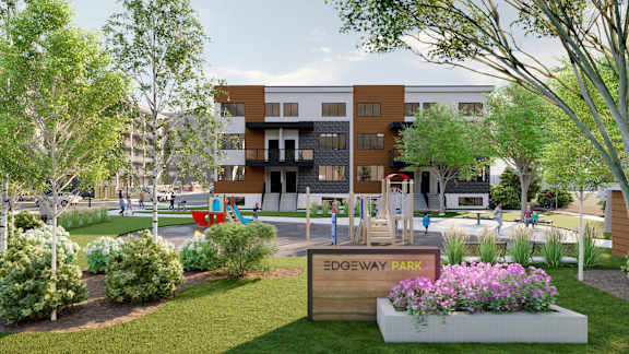 A modern building with a playground in front of it.