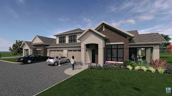 A modern house with a woman standing in front.