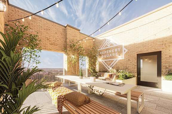 A long rectangular pool with a marble wall on one side. Foundry Yard, rentals by Berkeley Living.