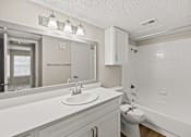 Thumbnail 9 of 19 - A white bathroom with a sink, toilet, and bathtub. at Highland Park, Texas, 76132