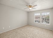 Thumbnail 1 of 19 - A room with a ceiling fan and carpeted floor. at Highland Park, Texas, 76132