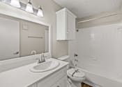 Thumbnail 17 of 19 - A white bathroom with a sink, toilet, and bathtub. at Highland Park, Texas, 76132
