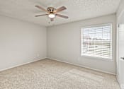 Thumbnail 18 of 19 - A room with a ceiling fan and a window with blinds. at Highland Park, Texas, 76132