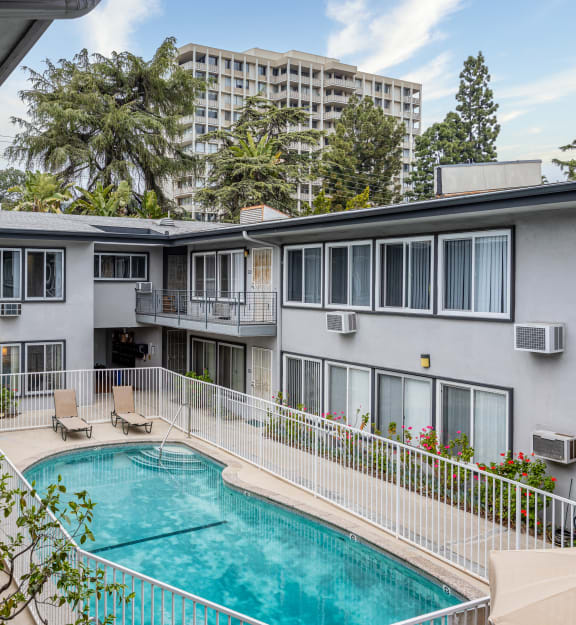 a view of the pool and pool house from the balcony