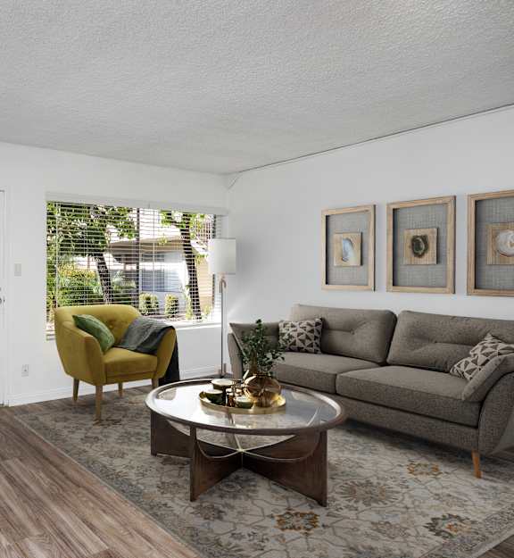an empty living room and kitchen with a ceiling fan