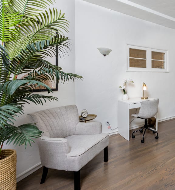 a bedroom with a bed and a chair