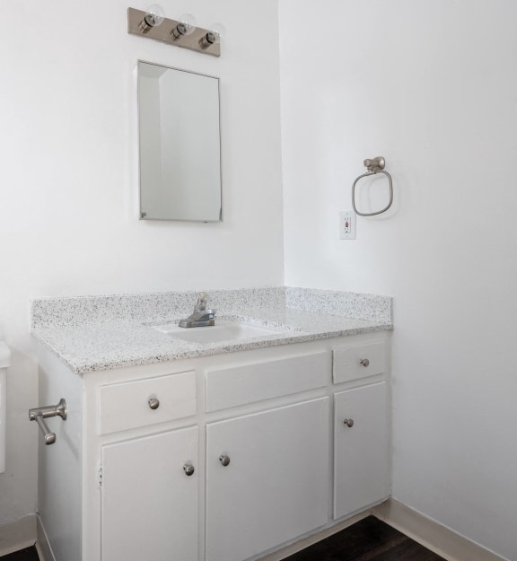 an empty bathroom with a sink and a toilet