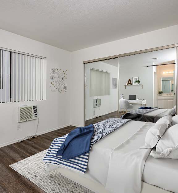 a kitchen with white cabinets and a sink and a stove