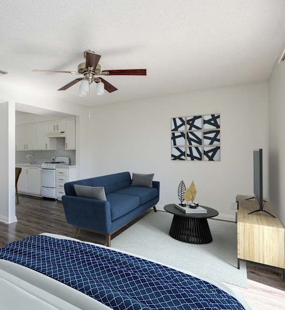an empty living room with a ceiling fan and a balcony