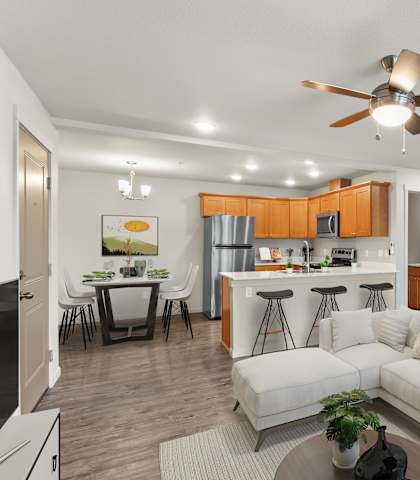 A modern living room with a white couch and a ceiling fan.